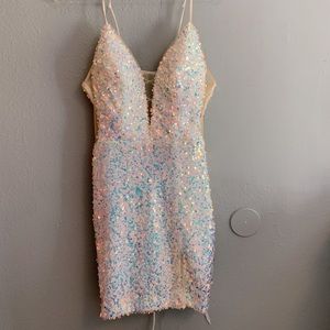 The dress is white itself but the sequins are multi colors.